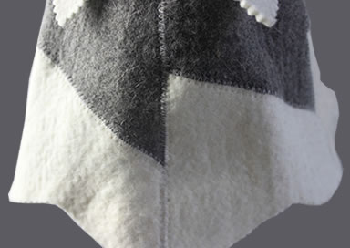 A detail of sauna hat overlock of natural white and gray 