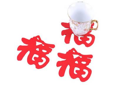 Three red wool felt coasters in Chinese Fu design.