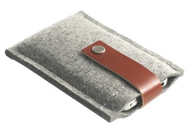A light gray wool felt phone bag with a snap faster on it and a mobile in the bag.