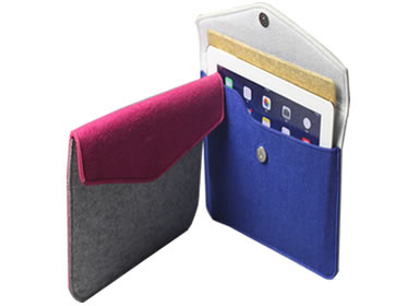 A dark pink and gray iPad bag lean on a blue iPad bag with an iPad in it.