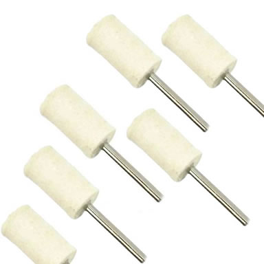 Six cylindrical wool felt bobs on the white background.