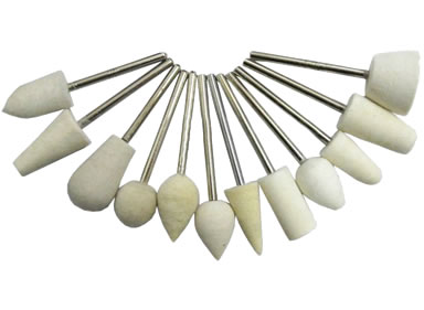 Twelve wool felt bobs with various different shapes.