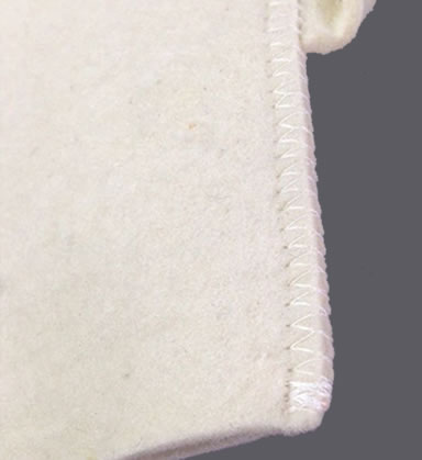 A detail of overlock of wool felt sauna glove.