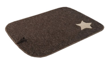 A piece of dark brown wool felt sauna mat with a pentagon applique on it.