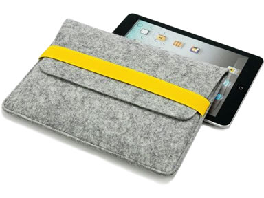 A black iPad is placed under a light gray elastic band wool felt tablet sleeve.